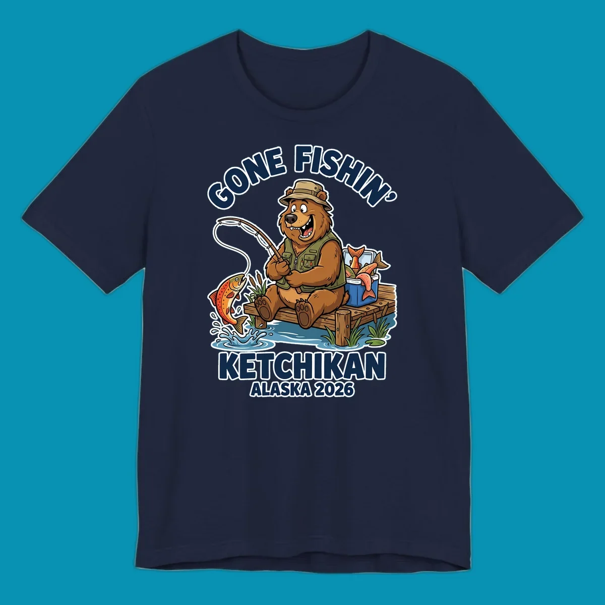 Cartoon bear in hat and vest fishing from a dock, with a fish on the line and cooler. Text: 'GONE FISHIN' KETCHIKAN ALASKA 2026'. Ideal for a gone-fishin-ketchikan-bear themed Alaska cruise.