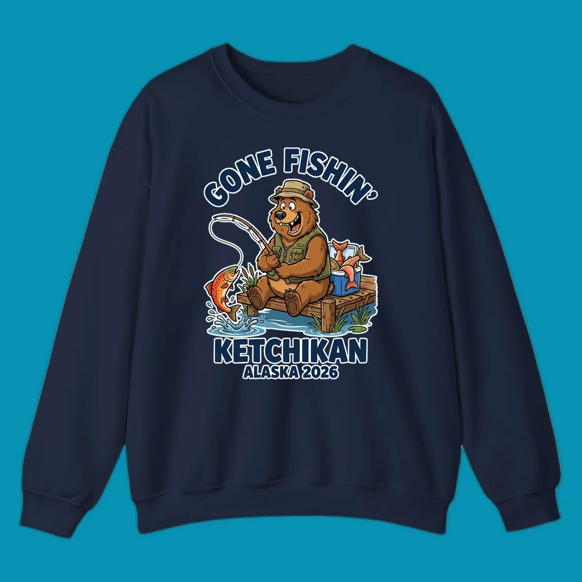 Cartoon bear in hat and vest fishing from a dock, with a fish on the line and cooler. Text: 'GONE FISHIN' KETCHIKAN ALASKA 2026'. Ideal for a gone-fishin-ketchikan-bear themed Alaska cruise.