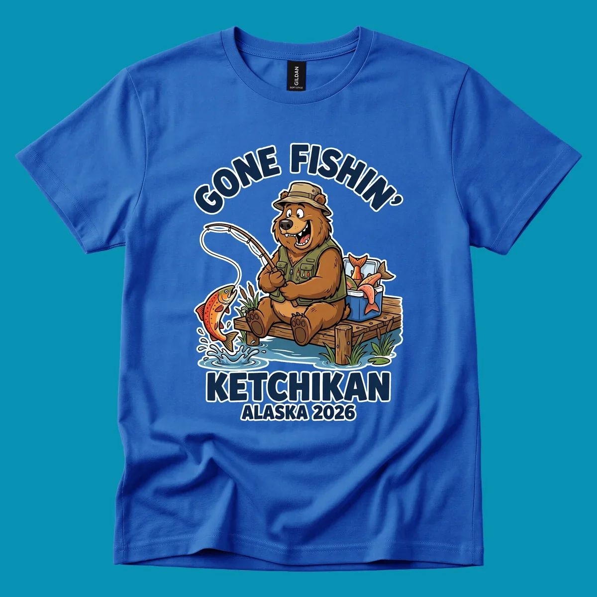 Cartoon bear in hat and vest fishing from a dock, with a fish on the line and cooler. Text: 'GONE FISHIN' KETCHIKAN ALASKA 2026'. Ideal for a gone-fishin-ketchikan-bear themed Alaska cruise.