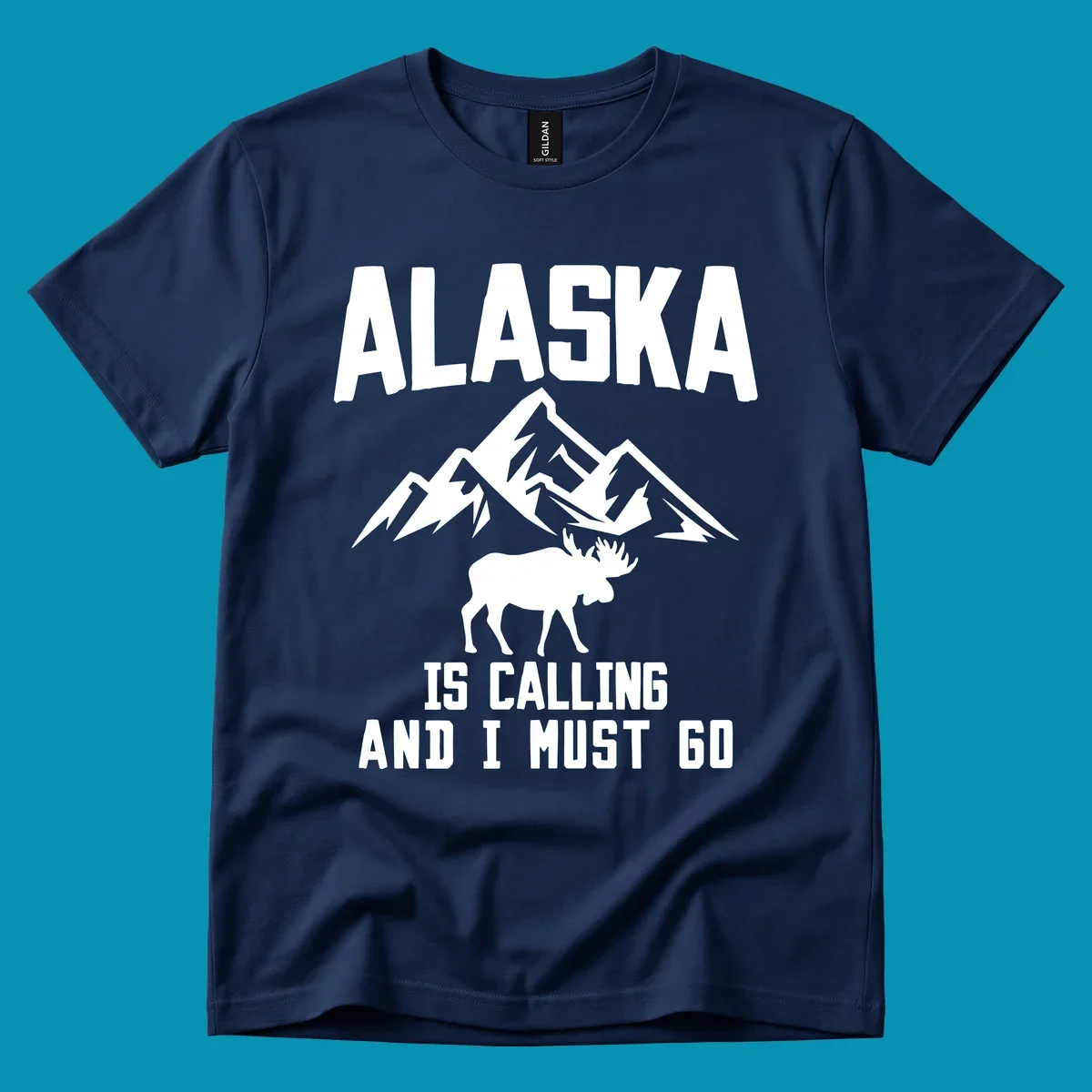 White moose silhouette and snow-capped mountains with text reading Alaska is calling and I must go