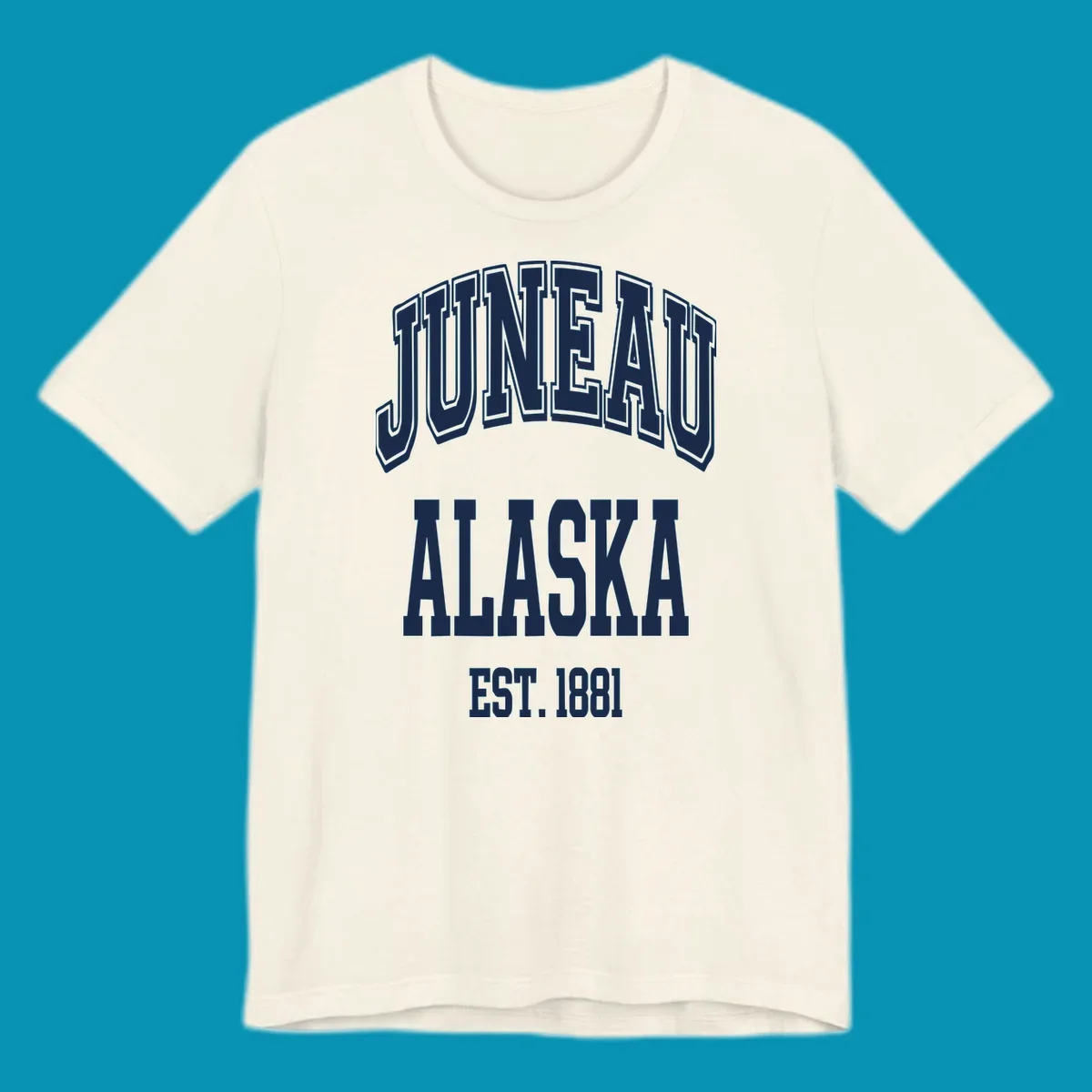 Bold 3D outlined text reading 'Juneau At Alaska Est 1881' in white lettering on gray background