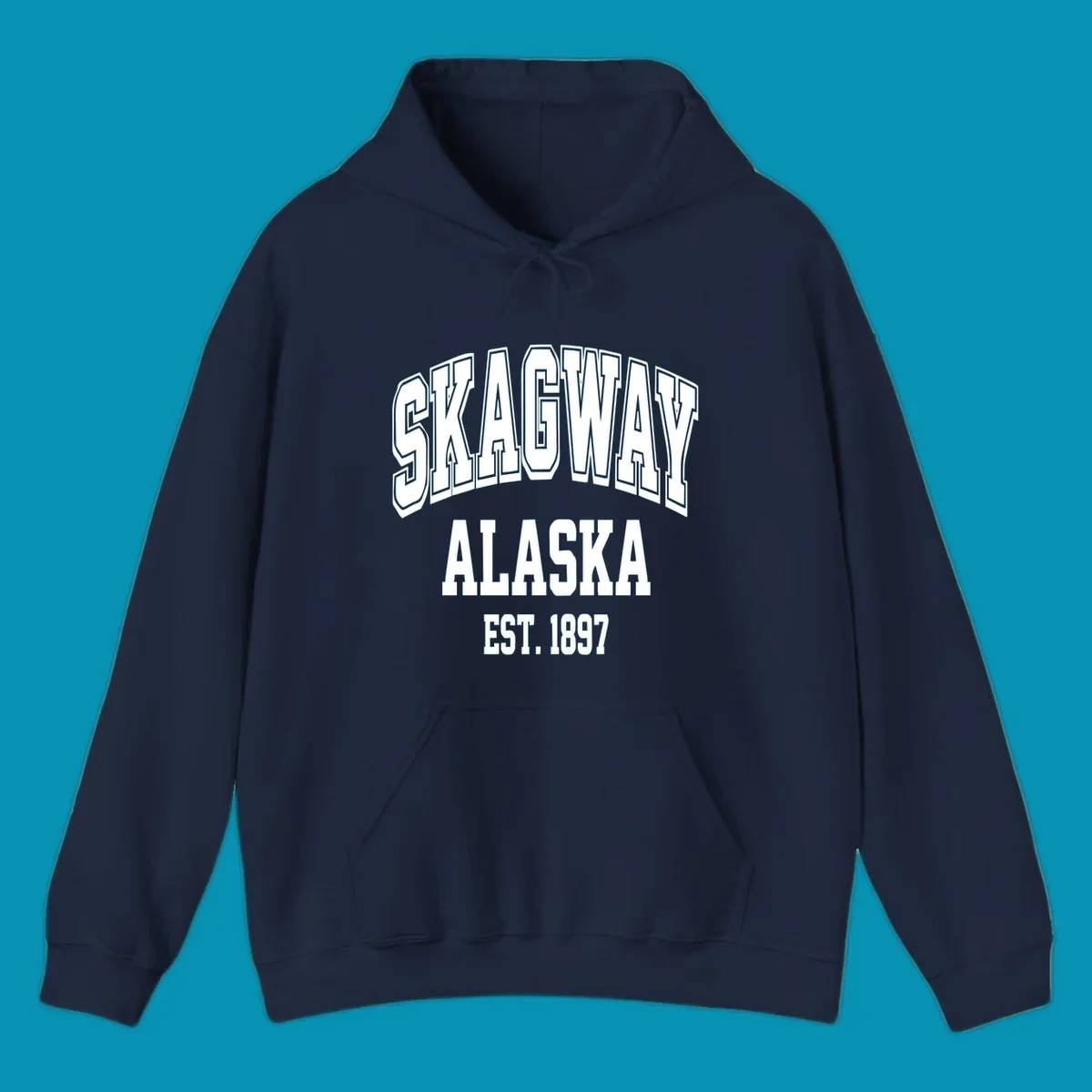 Vintage-style badge with bold outlined text reading Skagway Alaska Est. 1897 with decorative arrow accents on gray background.