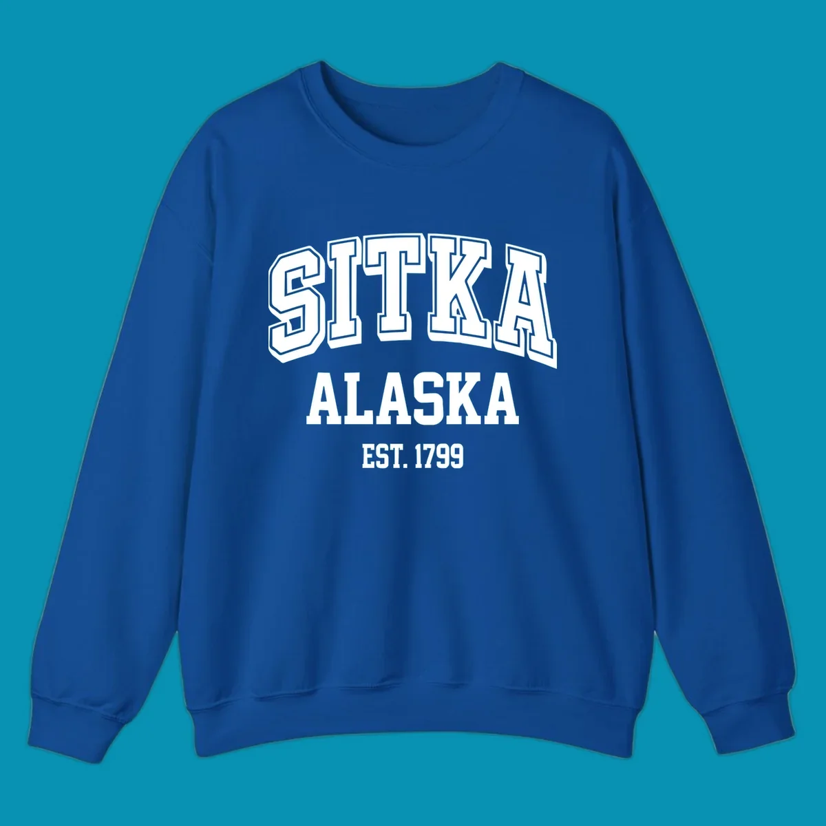 Vintage badge design reading Sitka Alaska Est. 1799 in bold outlined and solid white lettering on gray background