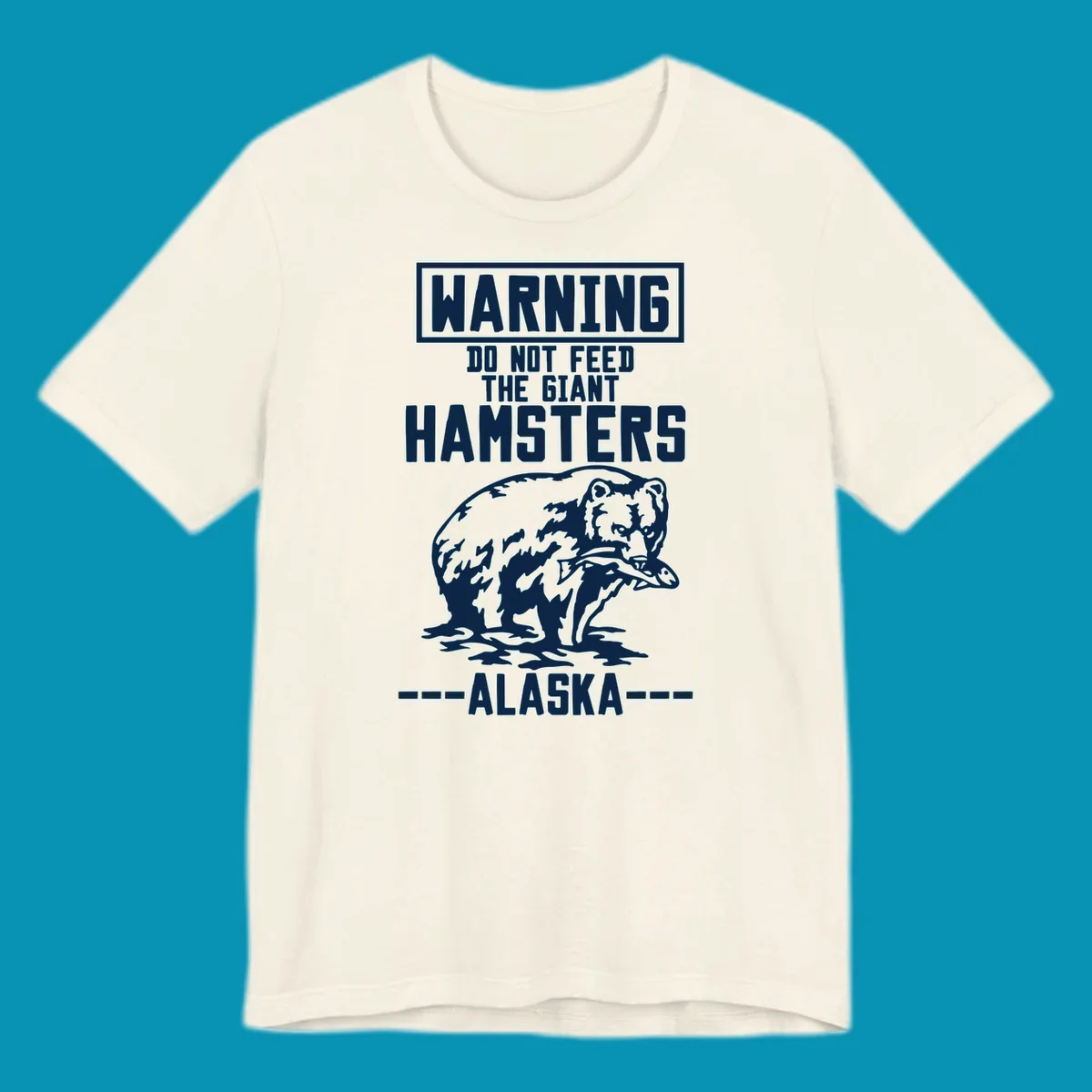 Warning-style design with giant hamster illustration and text reading 'Do Not Feed The Giant Hamsters Alaska' in white lettering on gray background