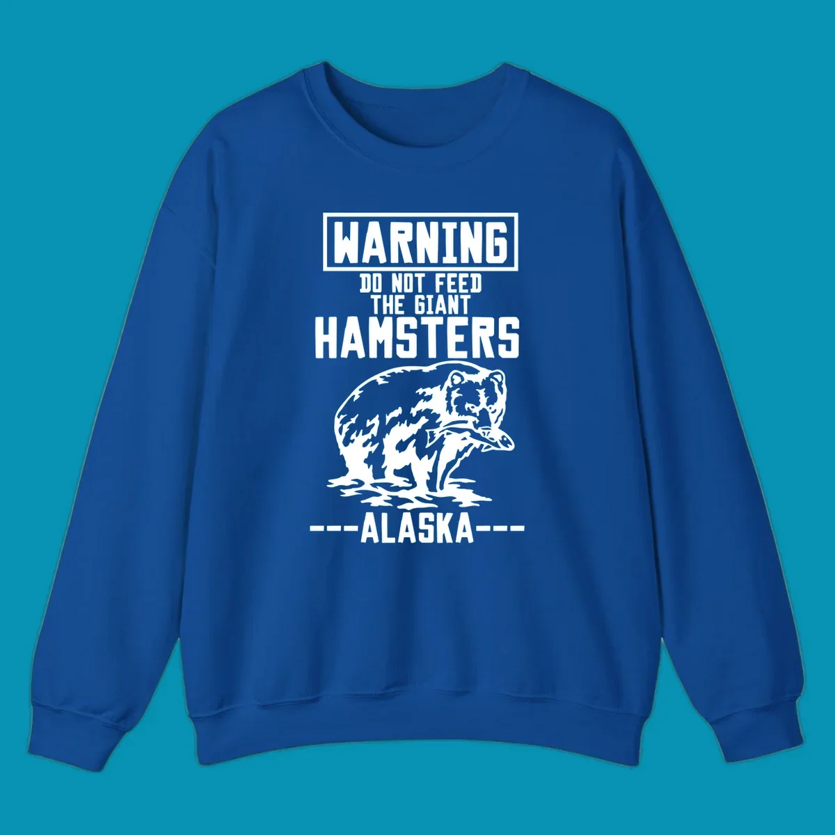 Warning-style design with giant hamster illustration and text reading 'Do Not Feed The Giant Hamsters Alaska' in white lettering on gray background