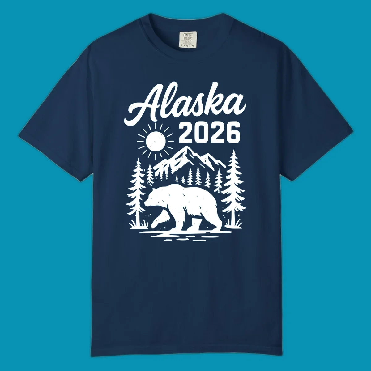 Alaska 2026 design featuring a polar bear walking through snowy mountains surrounded by evergreen trees and bright sun
