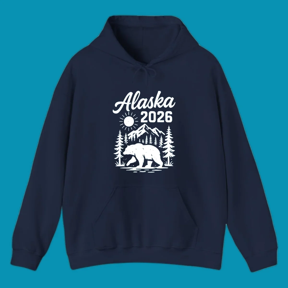 Alaska 2026 design featuring a polar bear walking through snowy mountains surrounded by evergreen trees and bright sun