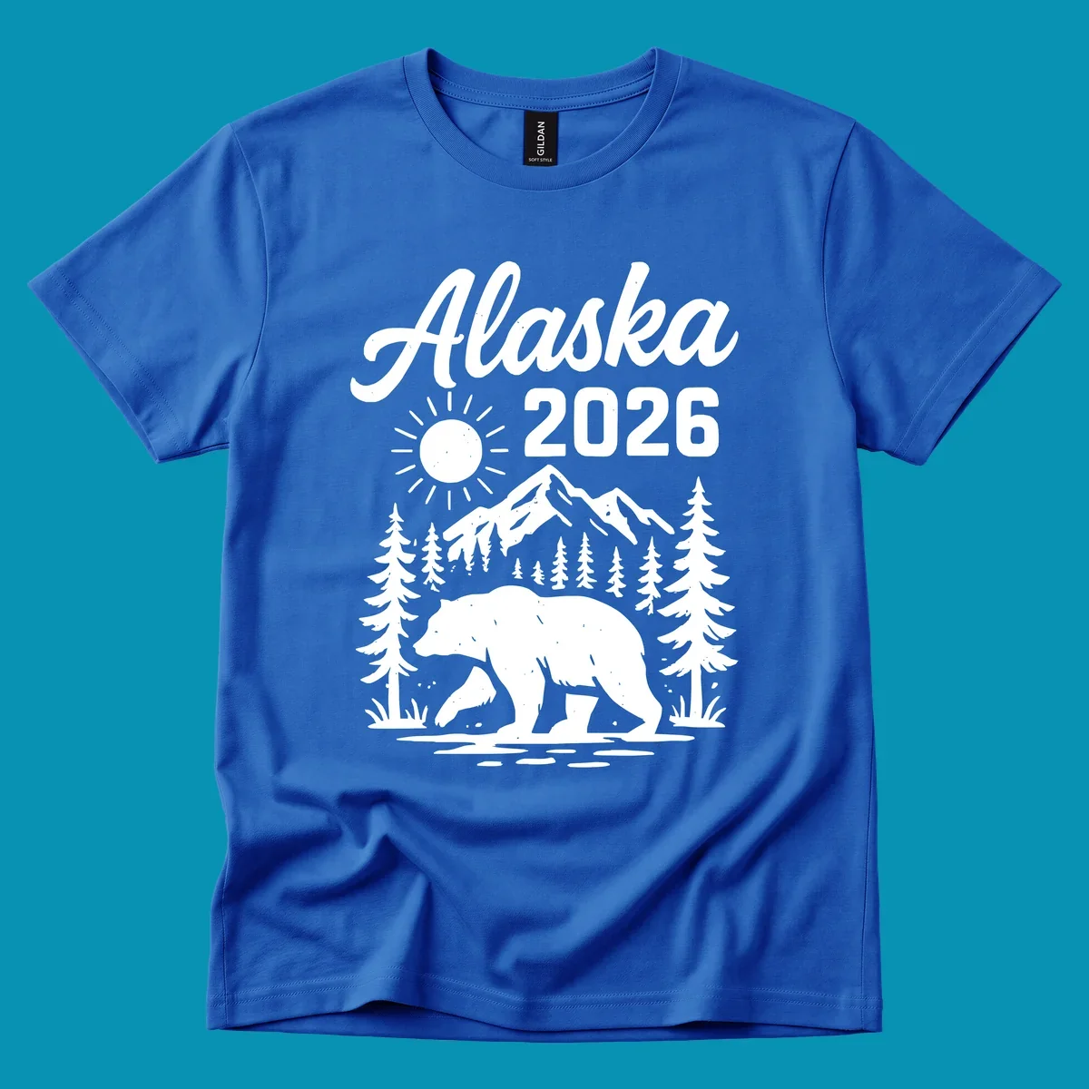 Alaska 2026 design featuring a polar bear walking through snowy mountains surrounded by evergreen trees and bright sun
