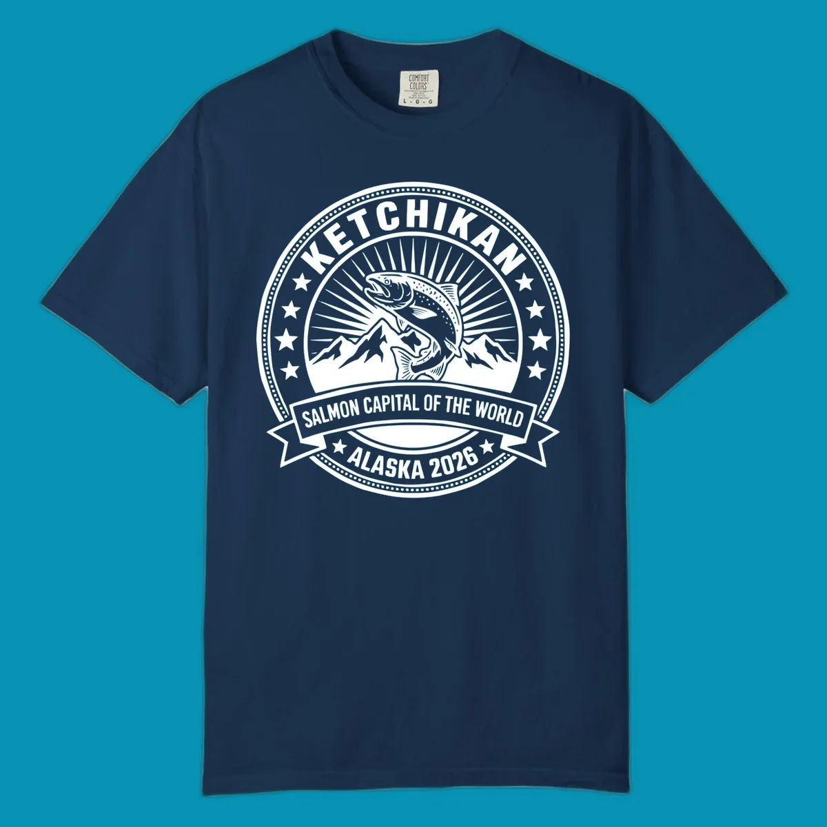 Ketchikan salmon capital badge with leaping salmon, mountain peaks, stars, and circular frame design