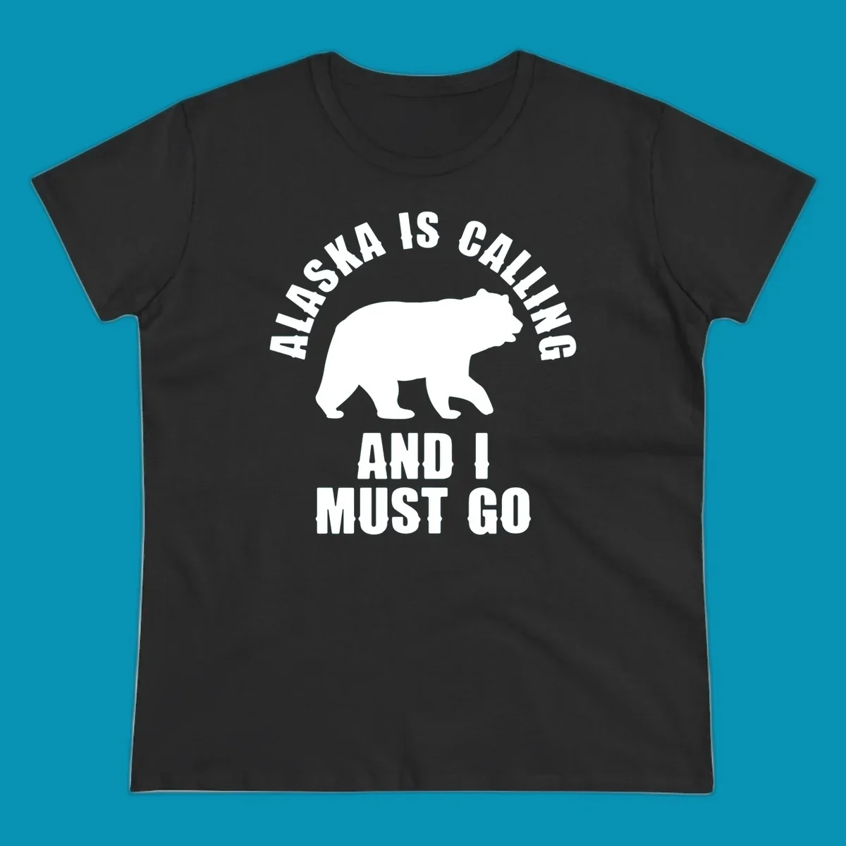White bear silhouette with curved text reading 'Alaska is calling and I must go' on gray background