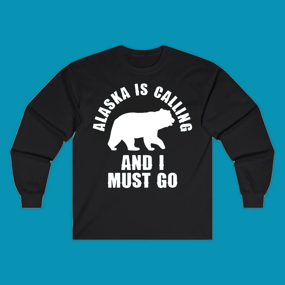 White bear silhouette with curved text reading 'Alaska is calling and I must go' on gray background