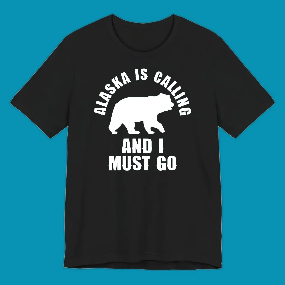 White bear silhouette with curved text reading 'Alaska is calling and I must go' on gray background