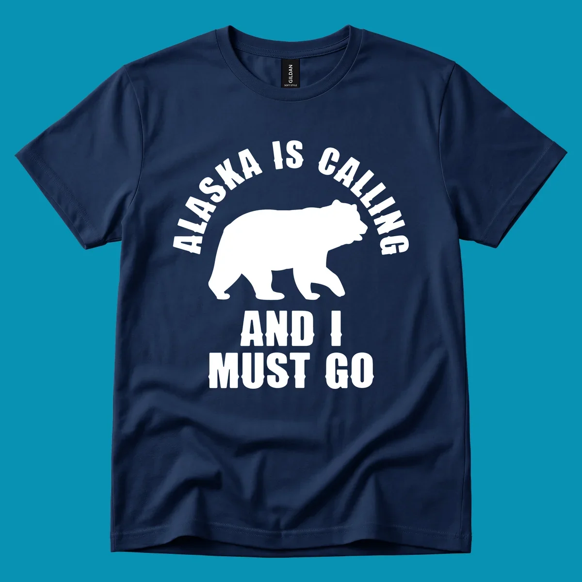 White bear silhouette with curved text reading 'Alaska is calling and I must go' on gray background