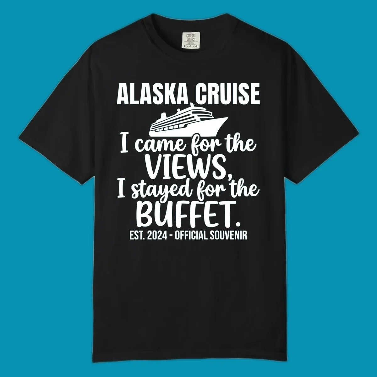 Gray t-shirt design with white cruise ship illustration and text reading 'I came for the views, I stayed for the buffet' — a funny Alaska cruise souvenir design