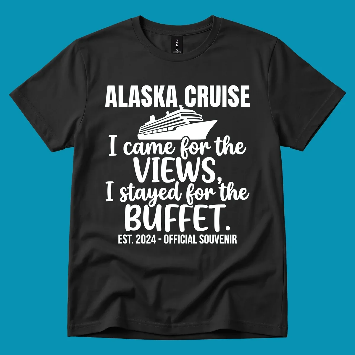 Gray t-shirt design with white cruise ship illustration and text reading 'I came for the views, I stayed for the buffet' — a funny Alaska cruise souvenir design