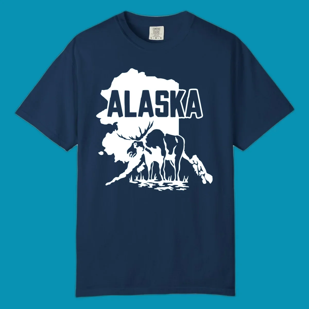 Alaska state map silhouette filled with moose, bear, and eagle wildlife illustrations with grass and water landscape elements