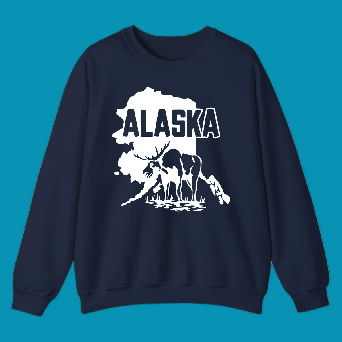 Alaska state map silhouette filled with moose, bear, and eagle wildlife illustrations with grass and water landscape elements