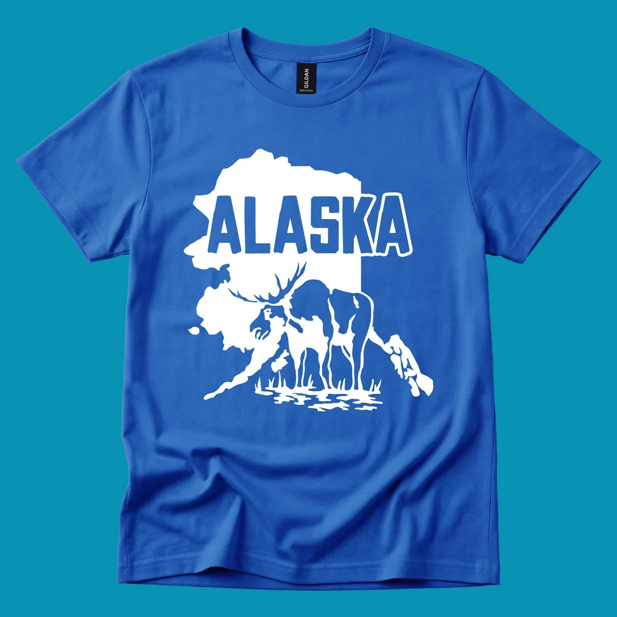 Alaska state map silhouette filled with moose, bear, and eagle wildlife illustrations with grass and water landscape elements