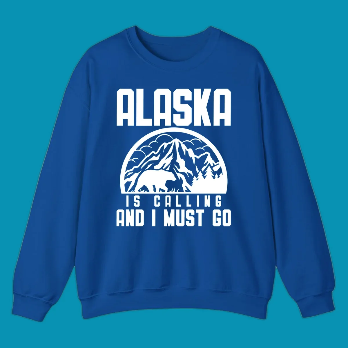 Vintage badge design with 'Alaska Is Calling And I Must Go' text, featuring mountain peak, bear, and evergreen trees