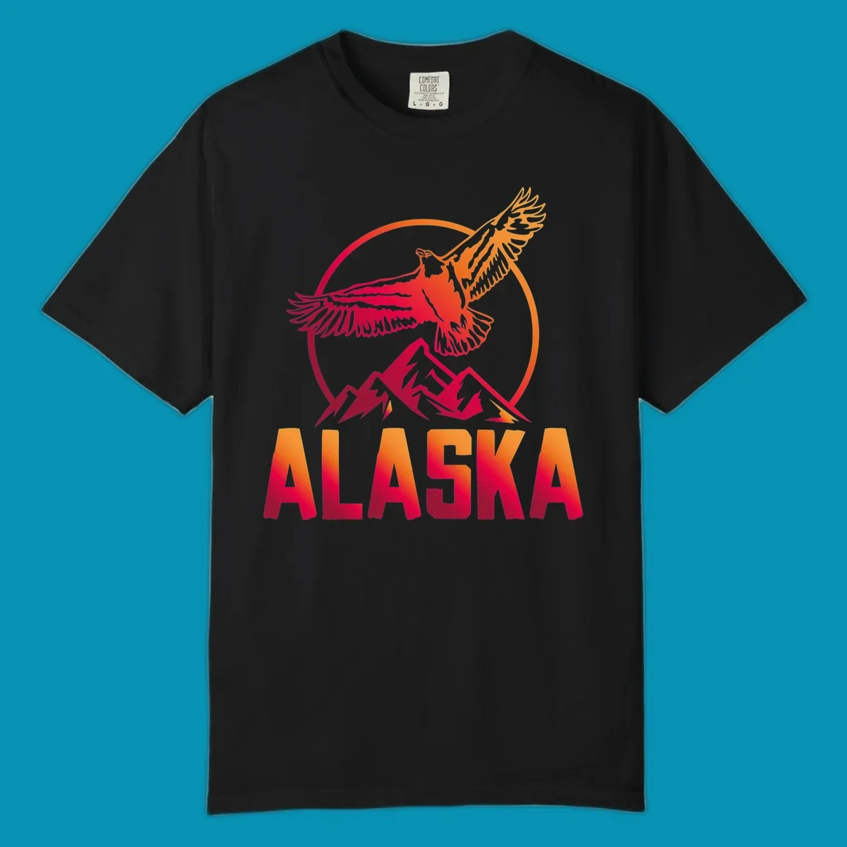 Eagle soaring above snow-capped mountains in red and orange gradient with Alaska text, circular badge design