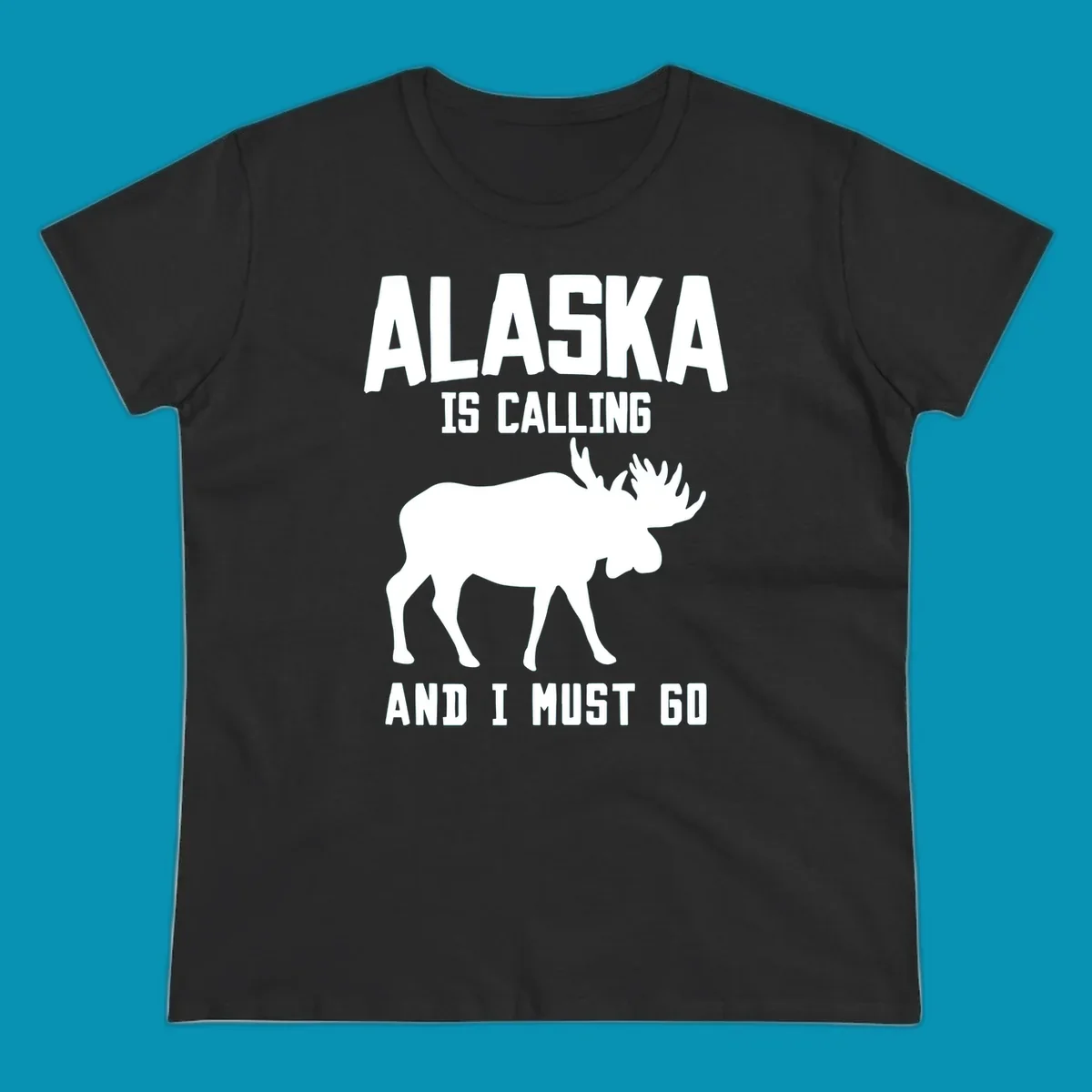 White moose silhouette with text 'Alaska Is Calling And I Must Go' on gray background—Alaska is calling moose design