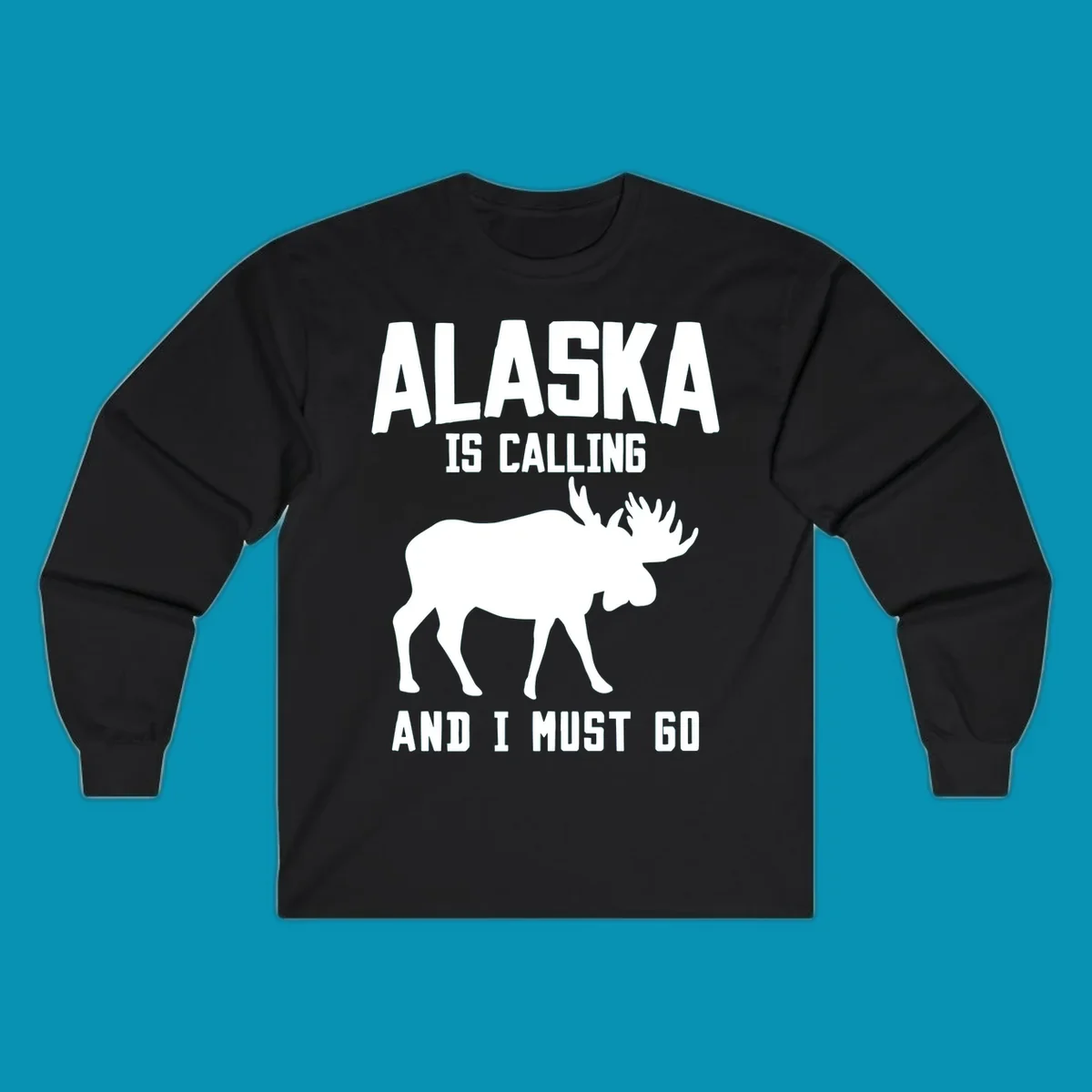 White moose silhouette with text 'Alaska Is Calling And I Must Go' on gray background—Alaska is calling moose design