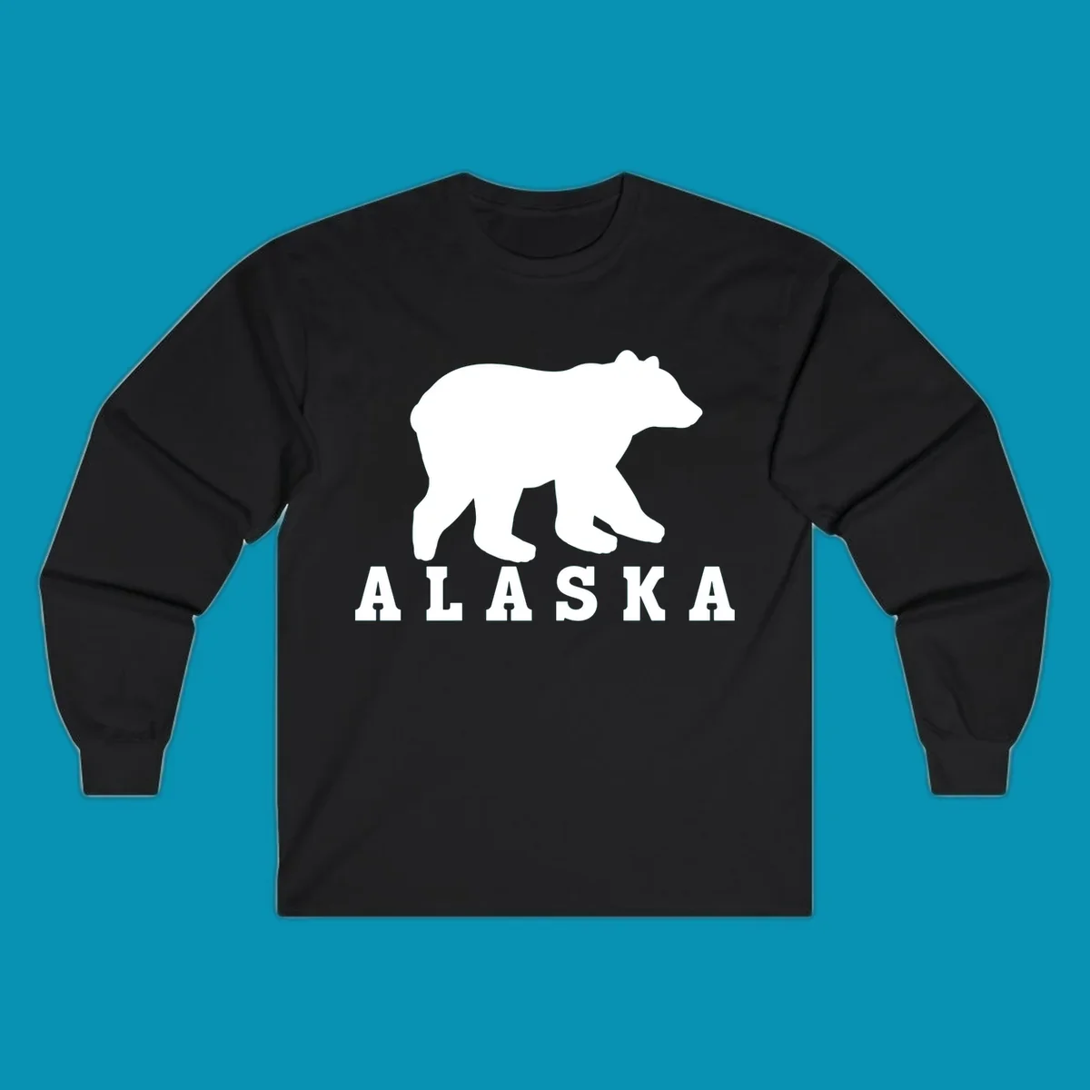 White bear silhouette standing with front paws visible, Alaska text below with pine tree accents on gray background