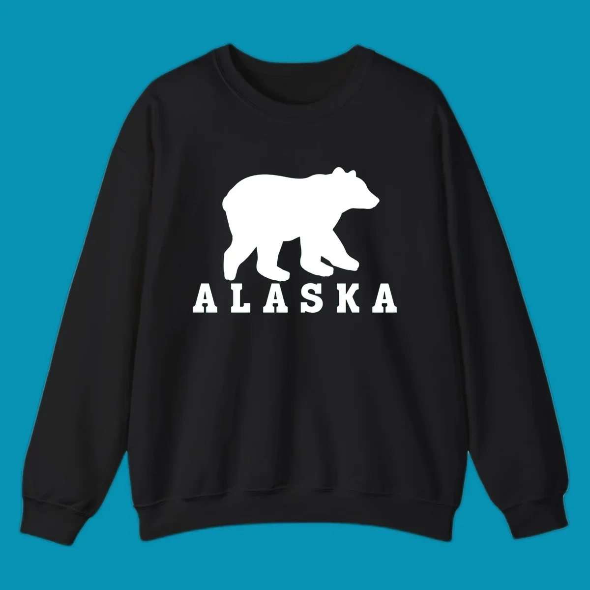 White bear silhouette standing with front paws visible, Alaska text below with pine tree accents on gray background