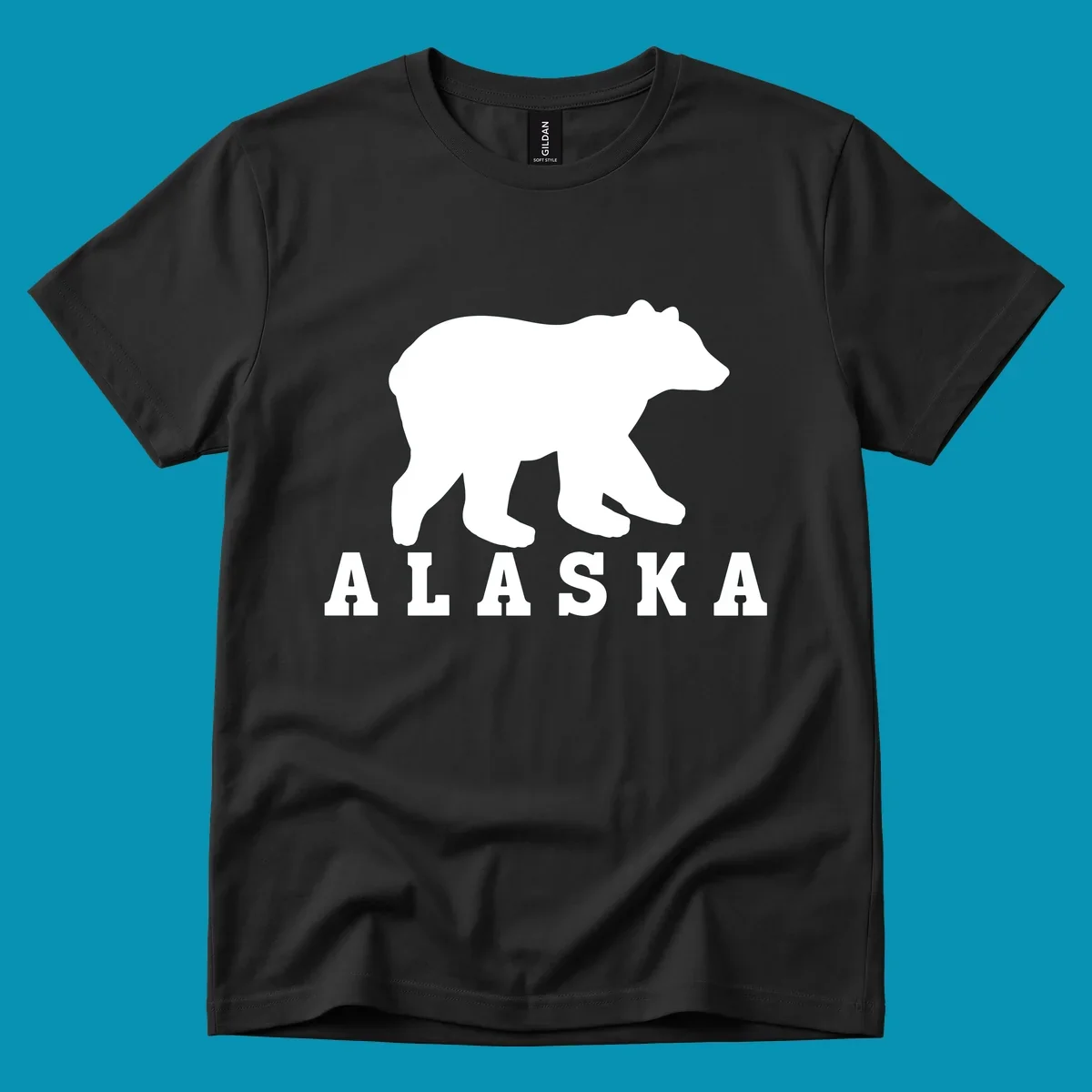 White bear silhouette standing with front paws visible, Alaska text below with pine tree accents on gray background