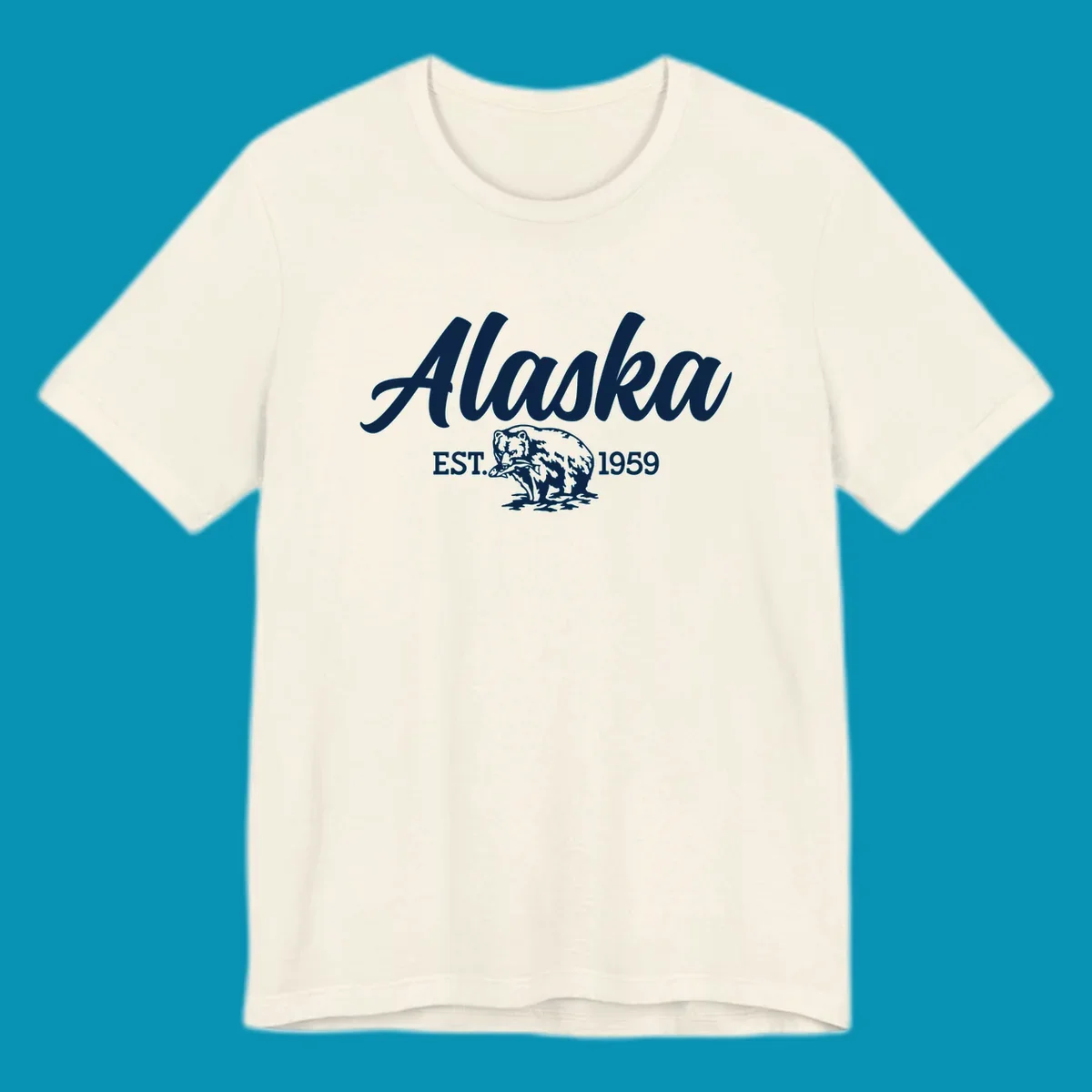 Vintage-style alaskan bear badge design with script lettering and established 1959 date on gray background