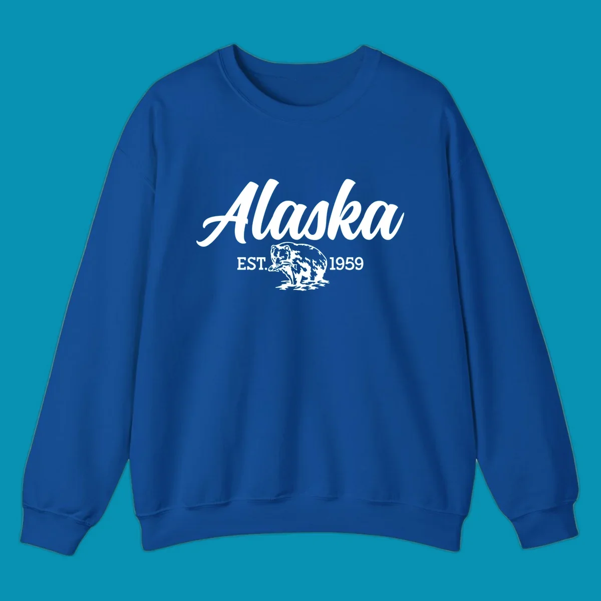 Vintage-style alaskan bear badge design with script lettering and established 1959 date on gray background