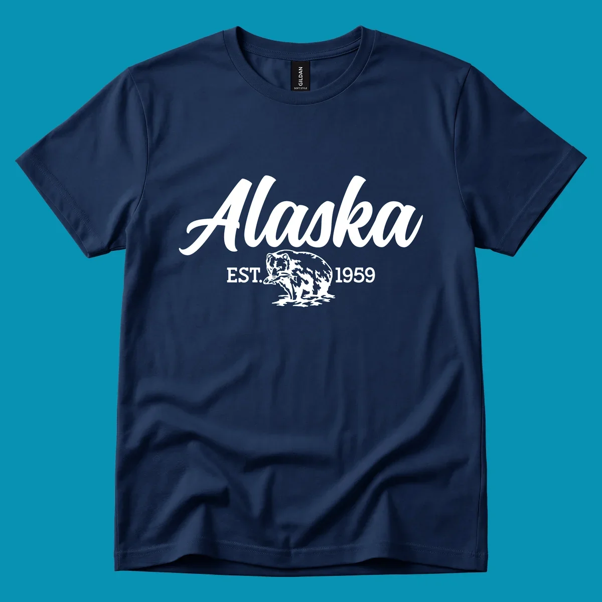 Vintage-style alaskan bear badge design with script lettering and established 1959 date on gray background