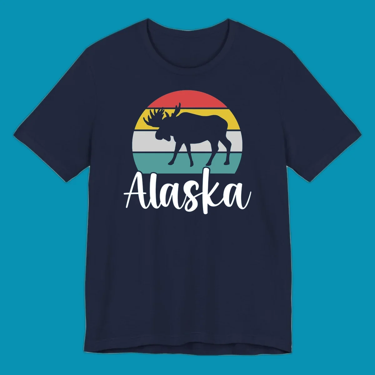 White moose silhouette against red, gold, gray, and teal horizontal stripes in a circular badge design representing Alaska mountains and wildlife.