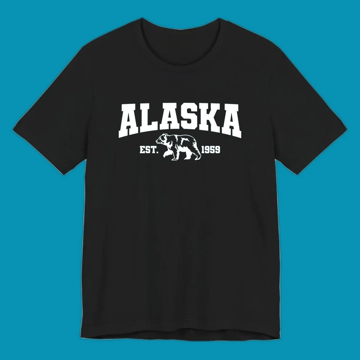 Vintage-style Alaska bear design with distressed lettering, established 1959, featuring pine trees and wildlife illustration