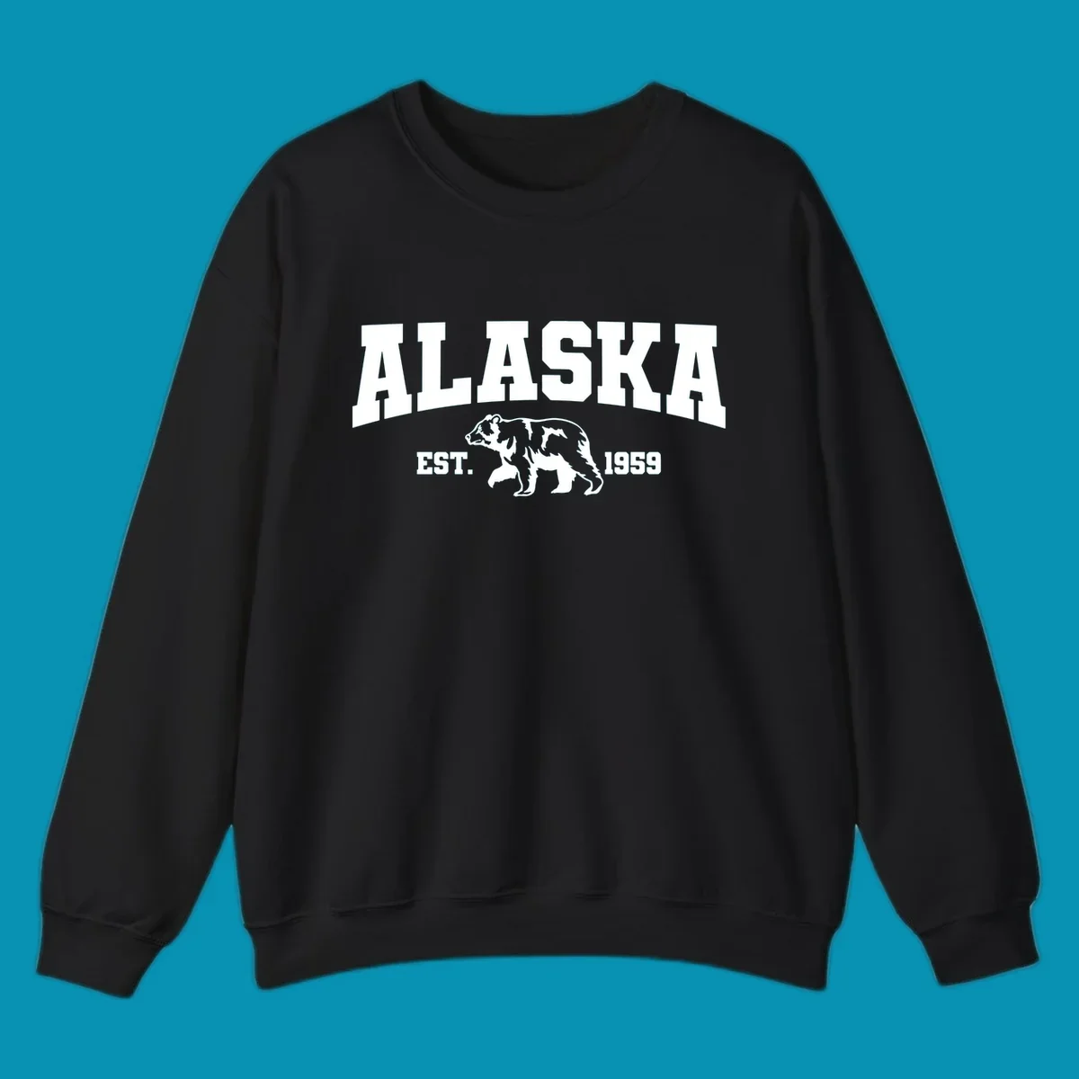 Vintage-style Alaska bear design with distressed lettering, established 1959, featuring pine trees and wildlife illustration