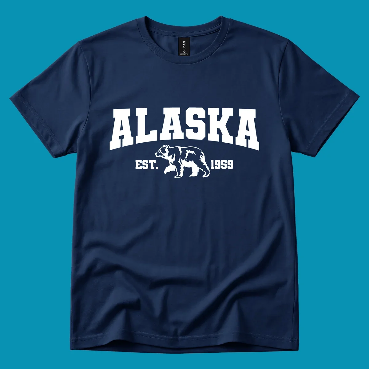 Vintage-style Alaska bear design with distressed lettering, established 1959, featuring pine trees and wildlife illustration