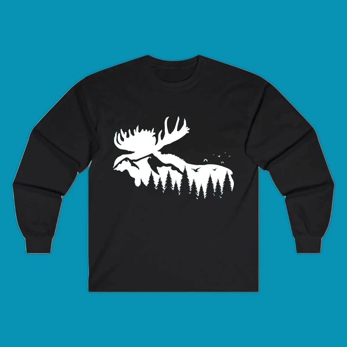 White silhouette of a moose with large antlers integrated into a forested mountain landscape with evergreen trees and flying birds against gray background.