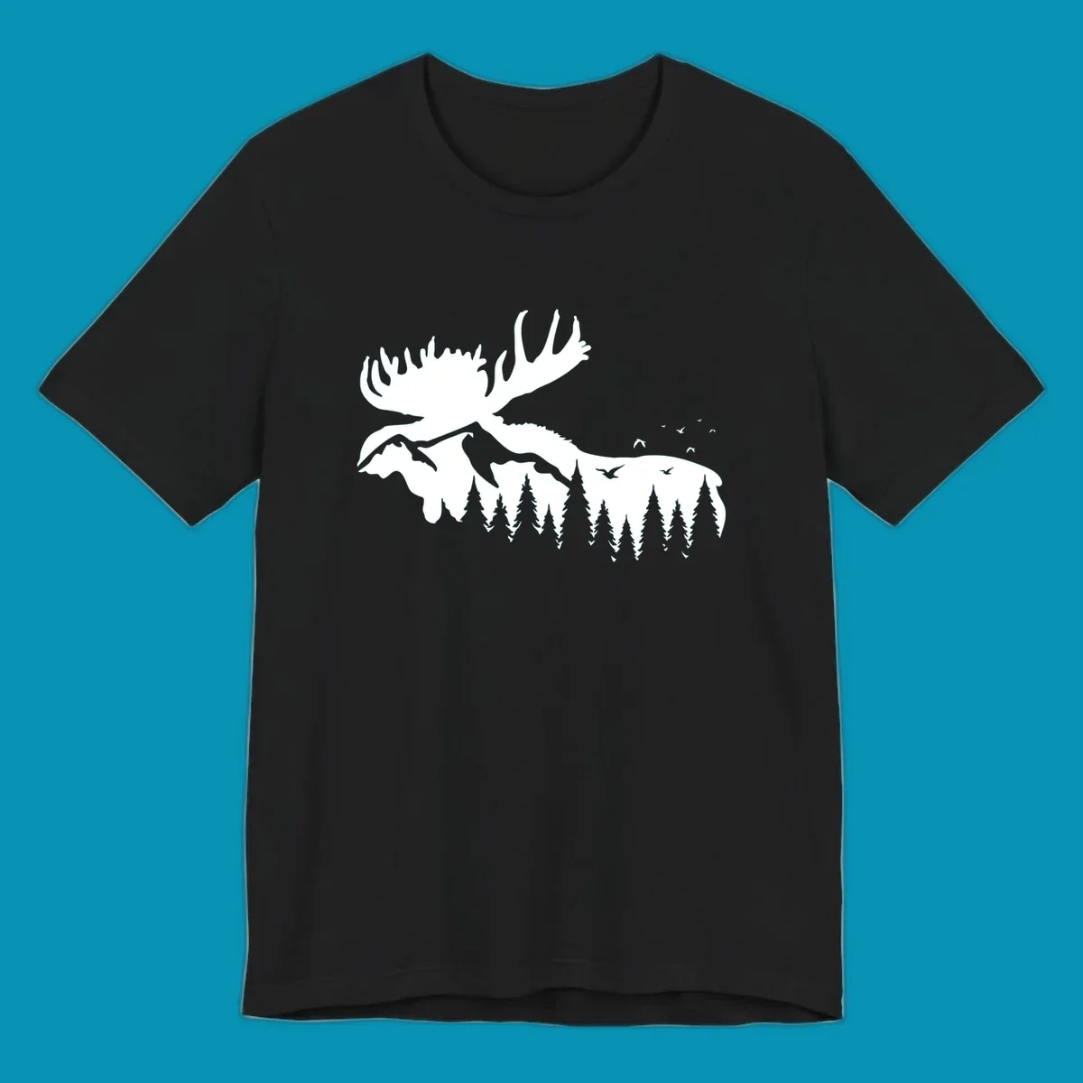 White silhouette of a moose with large antlers integrated into a forested mountain landscape with evergreen trees and flying birds against gray background.