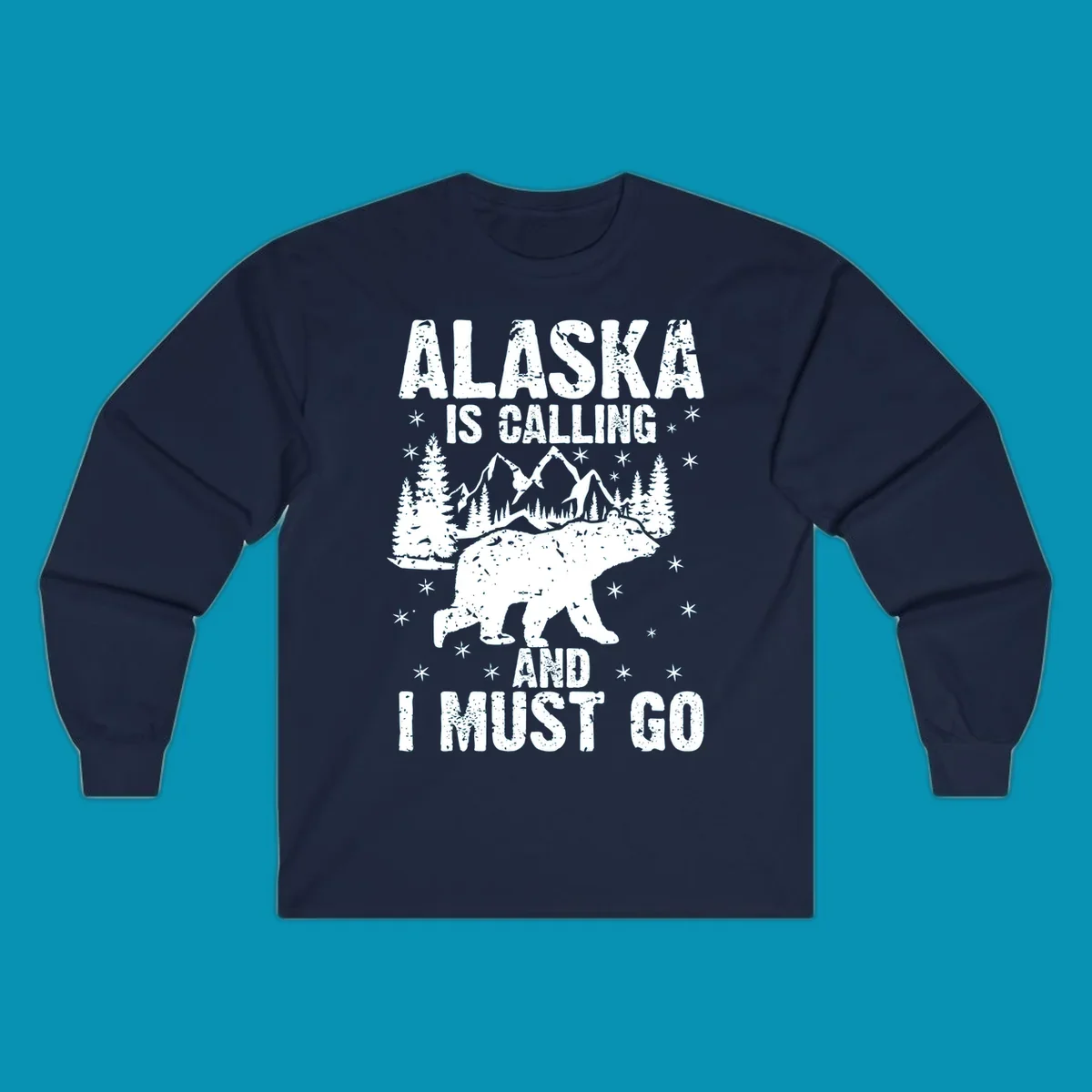 Distressed vintage design with polar bear in snowy mountains, text reads 'Alaska Is Calling And I Must Go'