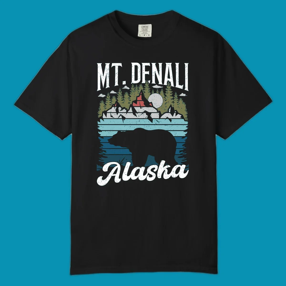 Bear cave winter wonderland illustration with bear head silhouette, snow cabin, evergreen forest, frozen lake, and moon for Alaska cruise shirt design.