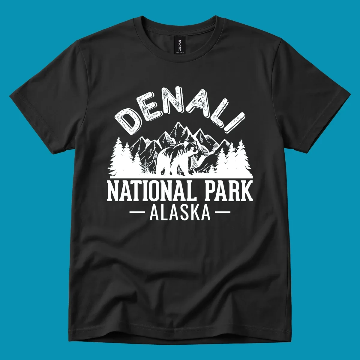 Denali National Park bear design with mountains, evergreen trees, and distressed white text on gray background