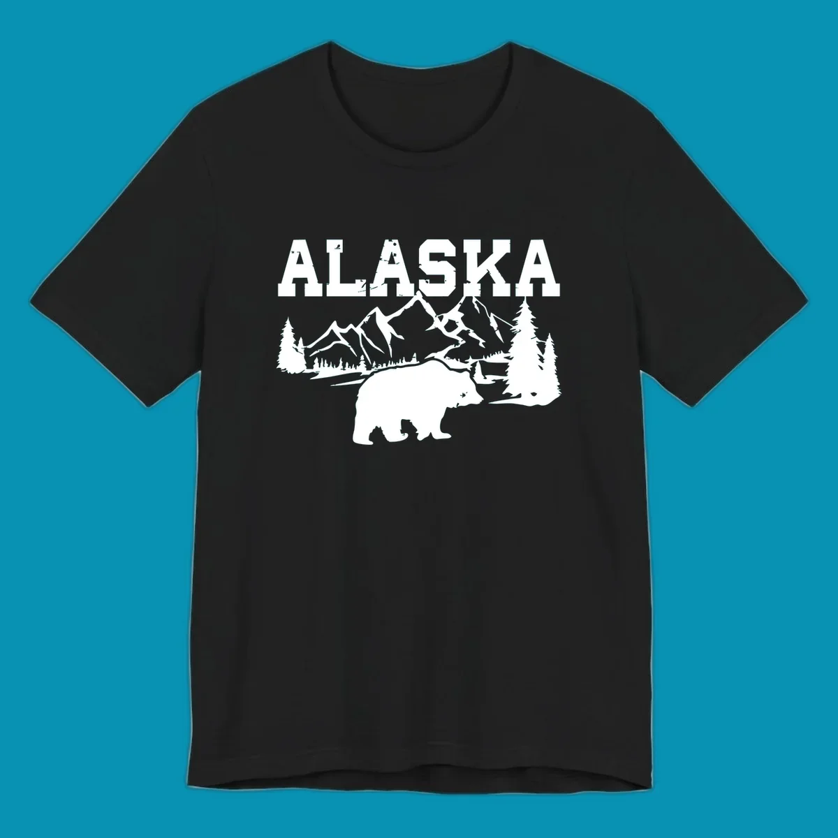 White silhouette illustration of a bear with mountains, evergreen trees, and river landscape under Alaska text on gray background