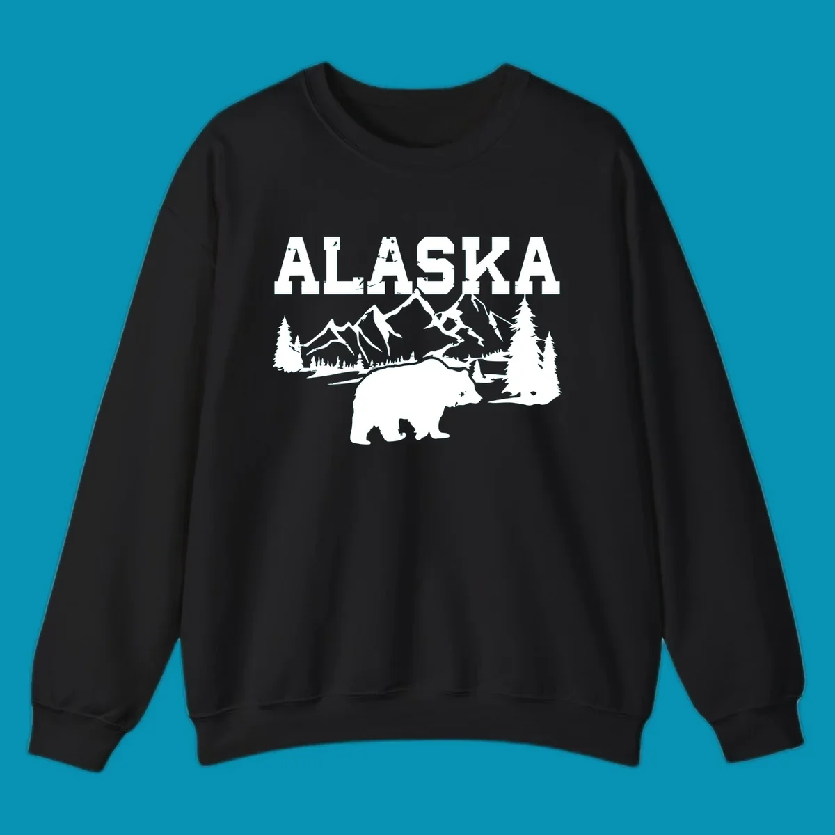 White silhouette illustration of a bear with mountains, evergreen trees, and river landscape under Alaska text on gray background