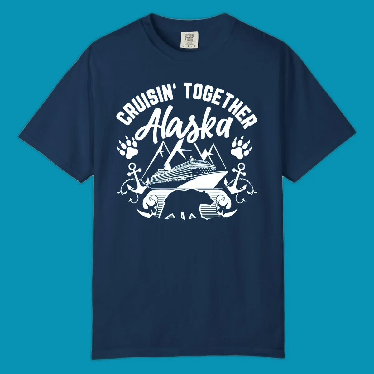 White nautical design on gray background featuring cruise ship between mountains with paw prints and anchors, text reads 'Cruisin' Together Alaska'