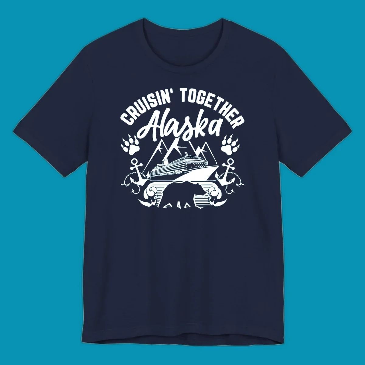 White nautical design on gray background featuring cruise ship between mountains with paw prints and anchors, text reads 'Cruisin' Together Alaska'