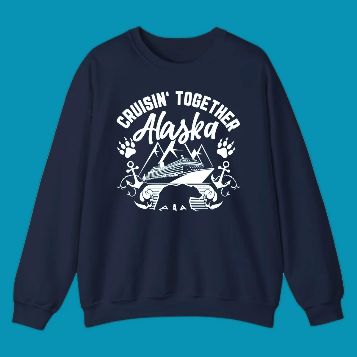White nautical design on gray background featuring cruise ship between mountains with paw prints and anchors, text reads 'Cruisin' Together Alaska'