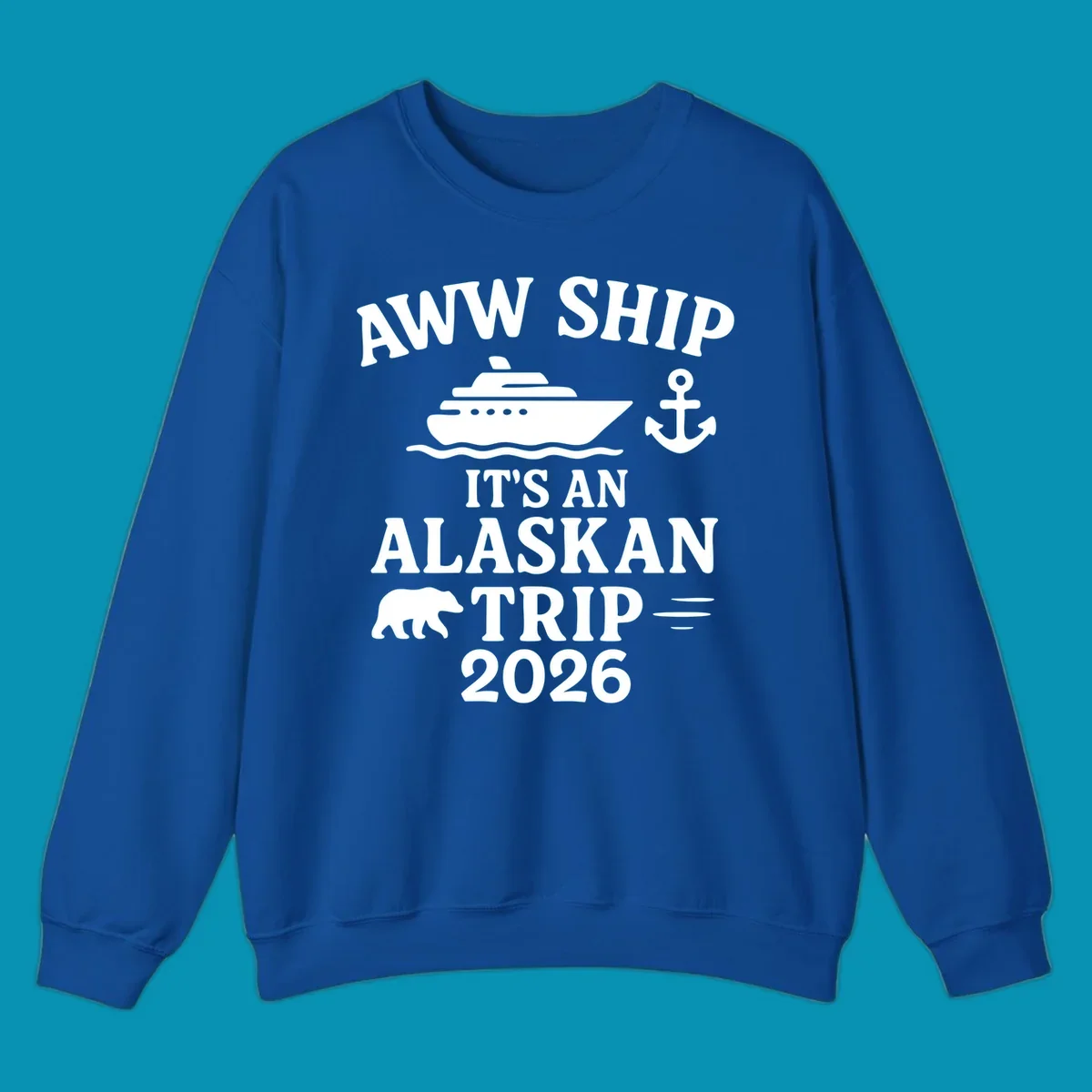 Gray design with white text reading 'Aww Ship It's An Alaskan Trip 2026' featuring a cruise ship, anchor, bear silhouette, and ocean waves