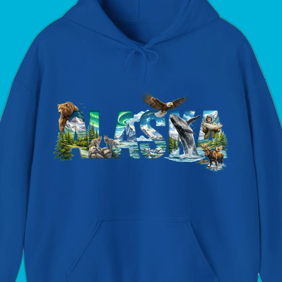An illustrated text design spelling "ALASKA" with images of a grizzly, mountains, northern lights, wolves, ocean, bald eagle, whale, fisherman, and moose. This alaska-wildlife-scenic-text design captures the state's natural beauty.