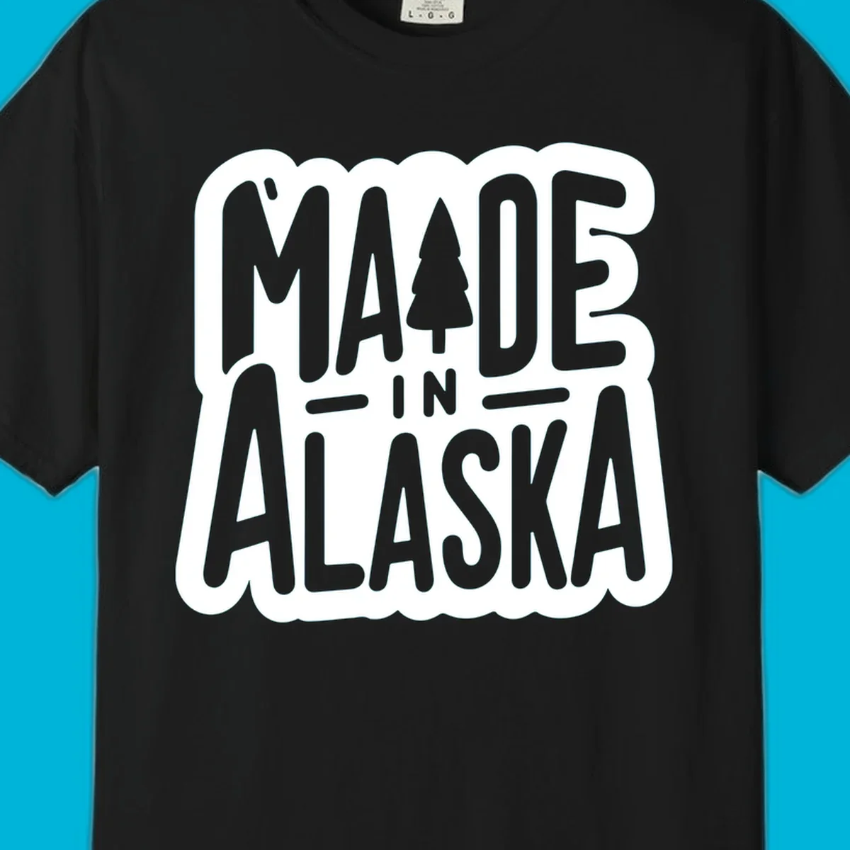 Stylized 'MADE IN ALASKA' text with a pine tree silhouette. A made-in-alaska-tree design.