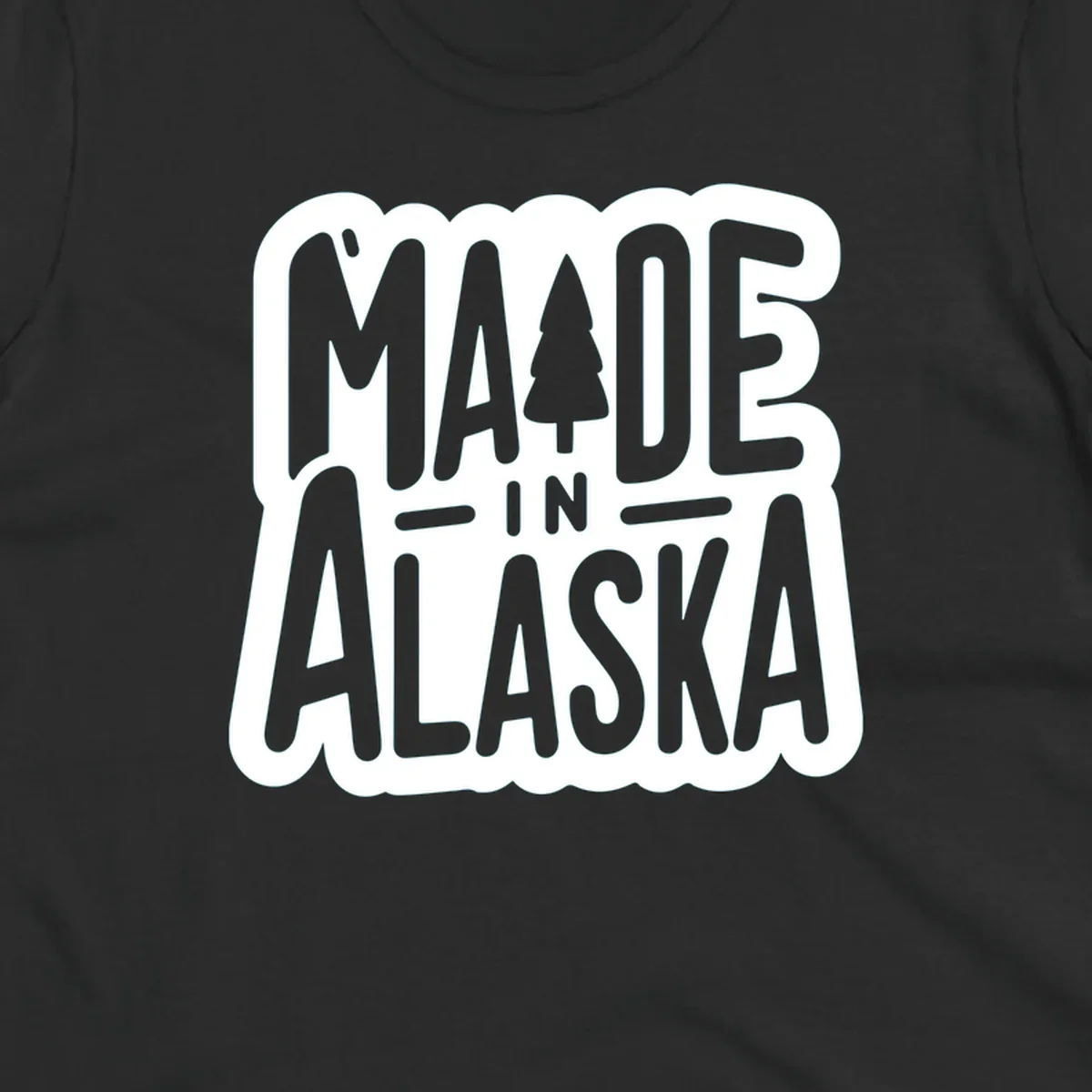Stylized 'MADE IN ALASKA' text with a pine tree silhouette. A made-in-alaska-tree design.